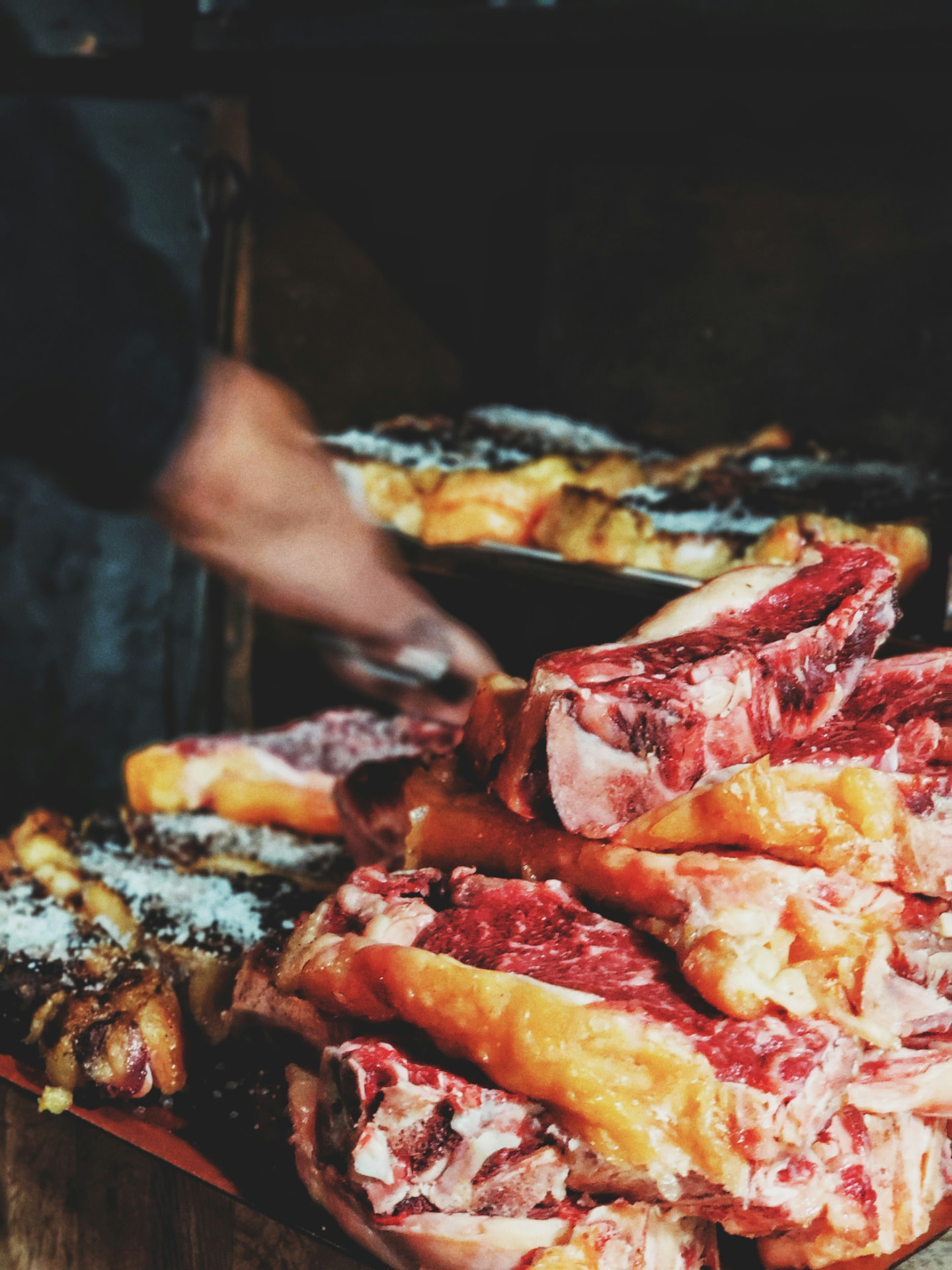 Cuts of meat over the wood-fired grill