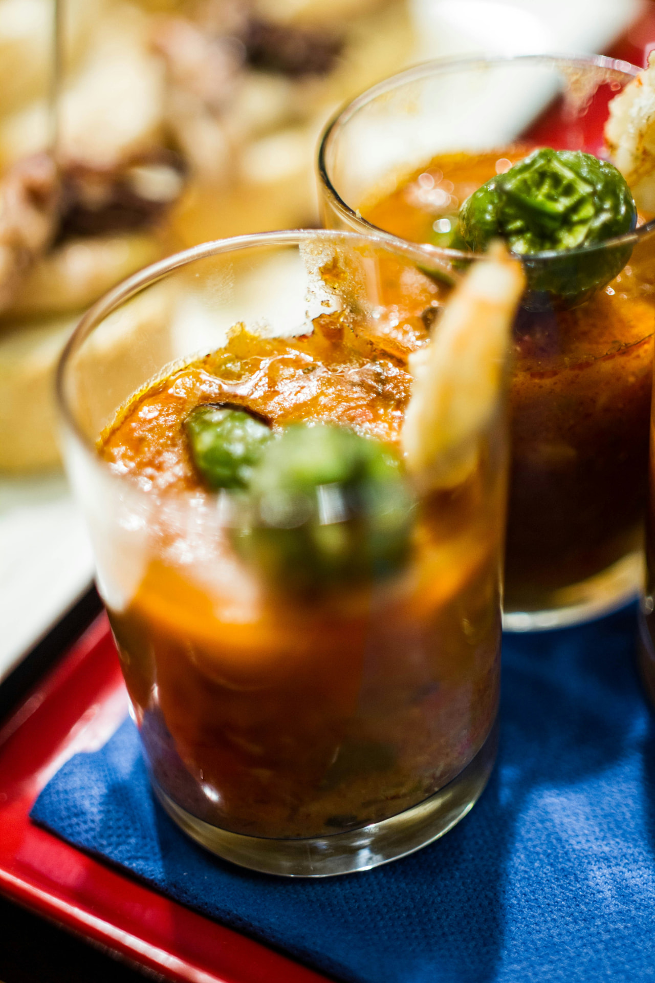 Glasses of chilled gazpacho with prawns and peppers